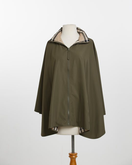 Green raincoat with checkered lining on a mannequin against a white background